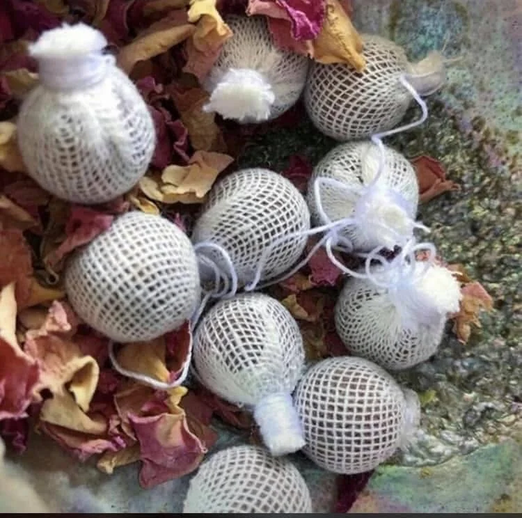 Organic Chinese herbs arranged in traditional medicine bowls